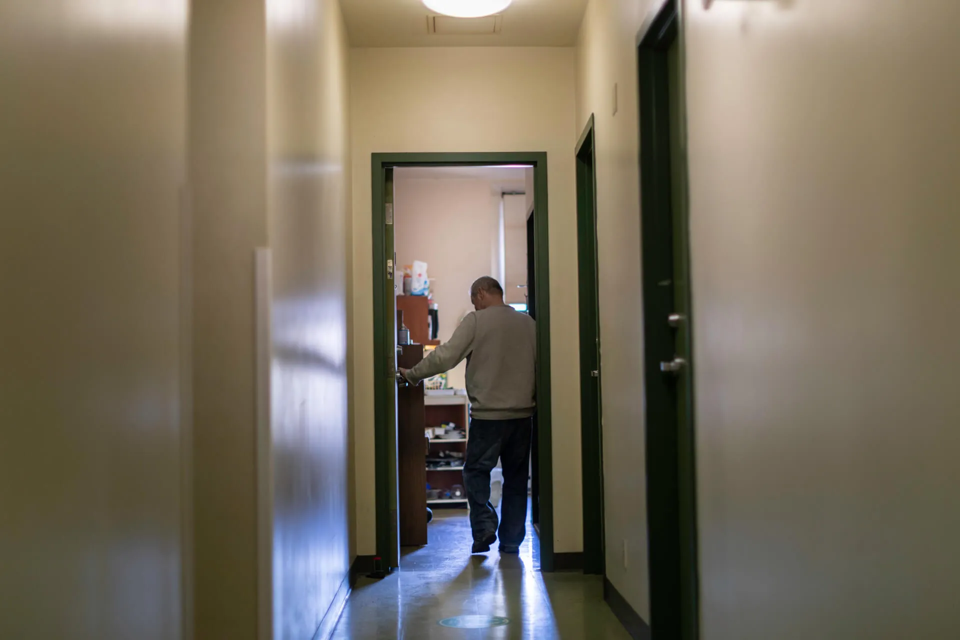 Marcelle et Jen Coutu Pavilion resident entering his apartment.