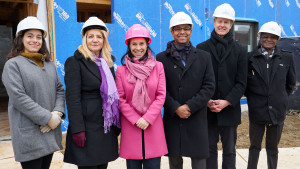 Dignitaries in front of the Projet Pie-IX construction site during the press conference announcing its new financing.